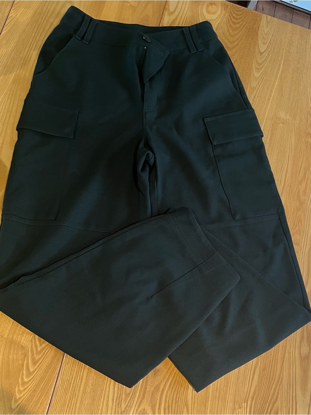 Women's Joelle Collection Cargo Pants in Dark Green (model Jafar)